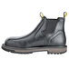 A black work boot with yellow rubber soles.