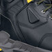 A close-up of a black and yellow safety shoe with a composite toe.