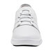 A white Shoes For Crews Karina athletic shoe with laces.