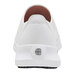 A white Shoes For Crews Karina athletic shoe with a white sole and a logo on the bottom.