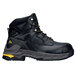 A close-up of a black ACE Burren work boot with yellow accents.