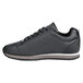 A black Shoes For Crews women's athletic shoe with a white sole.