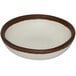 A white melamine ramekin with brown trim.