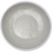 A white melamine serving bowl with speckled texture.