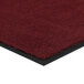 A red carpet mat with black border.