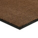 A roll of light brown Lavex Olefin entrance mat with black rubber edges.
