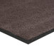 A close-up of a brown carpet with black rubber edges.