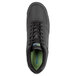 A close-up of a black SR Maxton athletic shoe with green accents.