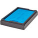 A black and blue plastic Cambro food pan carrier with a blue insert on a table.
