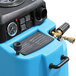 A close-up of a blue Mytee Speedster carpet extractor machine.