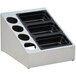 A stainless steel countertop condiment dispenser with 5 black trays.