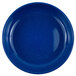 A medium blue Crow Canyon Home enamelware plate with white speckles.