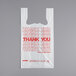 A white plastic T-shirt bag with "Thank You" written in red.