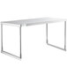 An Avantco stainless steel single deck overshelf on a white table with metal legs.