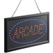 A white rectangular LED sign that says "Arcade" in black and red letters.
