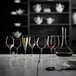 A table with Luigi Bormioli Riserva red wine glasses on it.