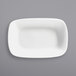 A white rectangular dish on a grey background.