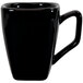 An International Tableware black porcelain tall cup with a handle.