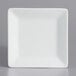 A white square International Tableware porcelain plate with a white rim.