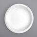 A white International Tableware porcelain serving bowl with a white rim.