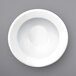 A white International Tableware Bristol porcelain bowl with a rolled edge.