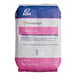 A white bag of ADM Cake Flour with pink and blue text.