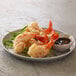 A plate of fried shrimp with Golden Dipt tempura batter and sauce.
