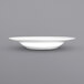 A close up of an International Tableware Bristol white porcelain pasta bowl with a wide rim.