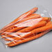 A clear plastic bag of carrots.
