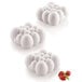 Silikomart Cloud silicone baking mold with three rectangular cavities with border designs, each filled with strawberries.