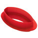 A red silicone baking mold with a plastic cutter.