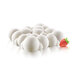 A white Silikomart cloud shaped silicone baking mold with a strawberry on top.