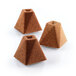 Brown pyramid-shaped pieces of cake made with a Silikomart mini pyramid silicone baking mold.