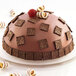 A Silikomart chocolate cake with a raspberry on top.