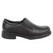 A black Rockport Works men's slip-on dress shoe with a rubber sole.