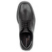 A black Rockport men's leather oxford dress shoe with laces.