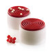 Two red and white cakes with a spiral design on top.