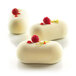 Silikomart PILLOW 80 dessert mold with white desserts topped with raspberries.