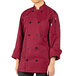 A person wearing a Uncommon Chef long sleeve burgundy chef coat.