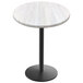A white round Holland Bar Stool EnduroTop table top on a black round base.
