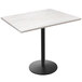 A white Holland Bar Stool EnduroTop table with a round black base.