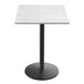 A white square Holland Bar Stool EnduroTop table with a white surface and a black round base.
