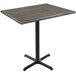 A Holland Bar Stool EnduroTop bar height table with a charcoal wood laminate top and black cross base.