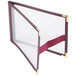 A burgundy Menu Solutions sewn edge table tent with a gold border.