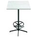 A white square Holland Bar Table with a white ash wood laminate surface and a black metal base with foot rest.
