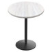 A white round Holland Bar Stool EnduroTop table with a black round base.