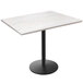 A white Holland Bar Stool EnduroTop table with a white ash wood top and round base.