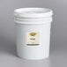 A Golden Barrel 5 gallon white bucket with a label.