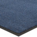 A close up of a blue Lavex Olefin carpet mat with black border.