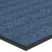 A blue Lavex Chevron Rib indoor entrance mat with a black border.